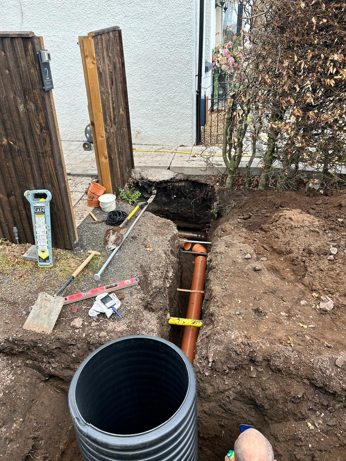 Drainage trench excavated to full depth with perforated pipe laid to falls, Perthshire