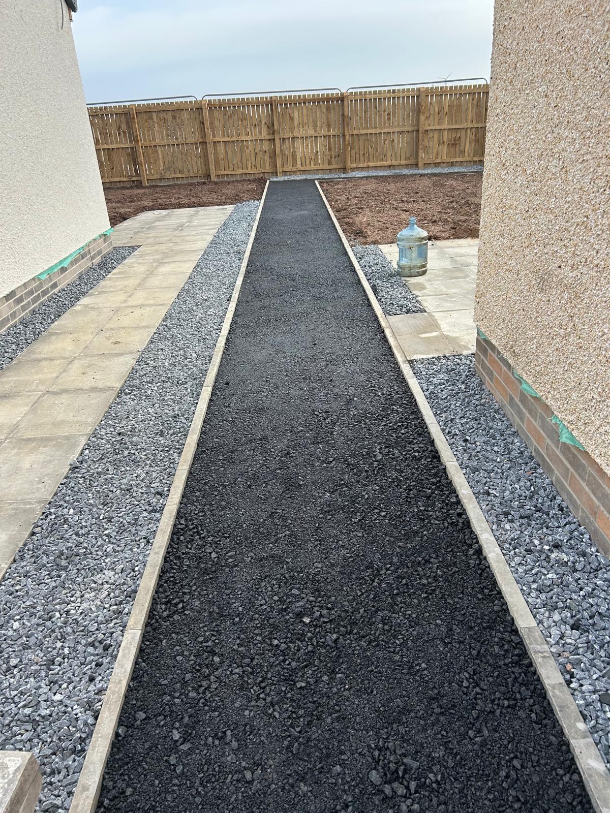 Completed driveway pathway with landscaping