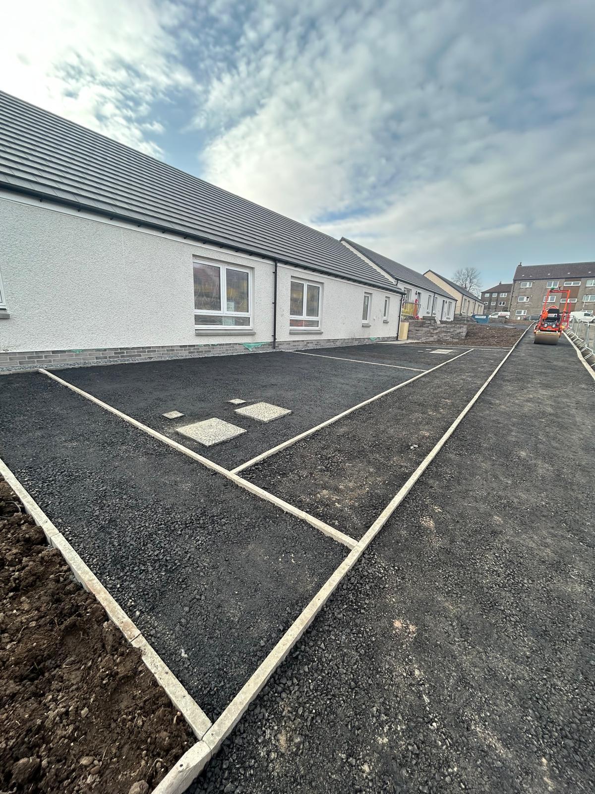 Tarmac surfacing and kerb edging on new-build residential development