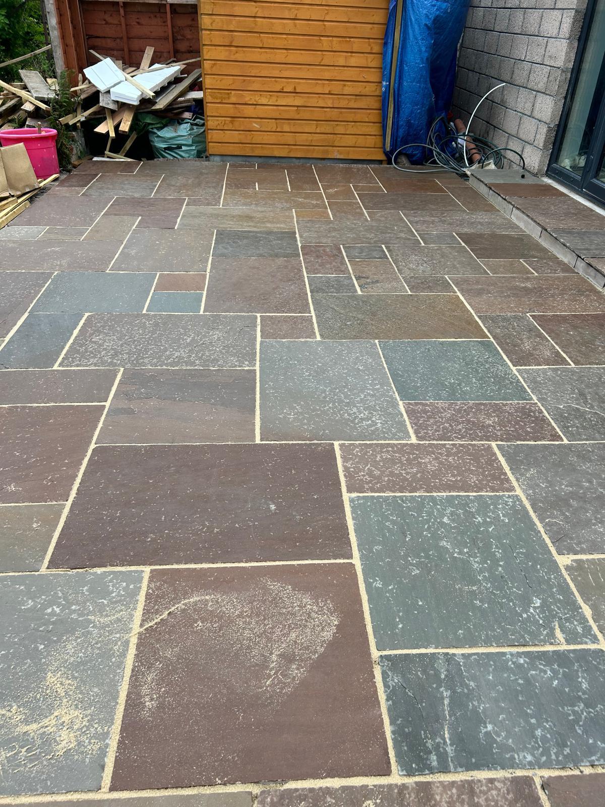 Natural sandstone patio with coordinating step edging, Perthshire